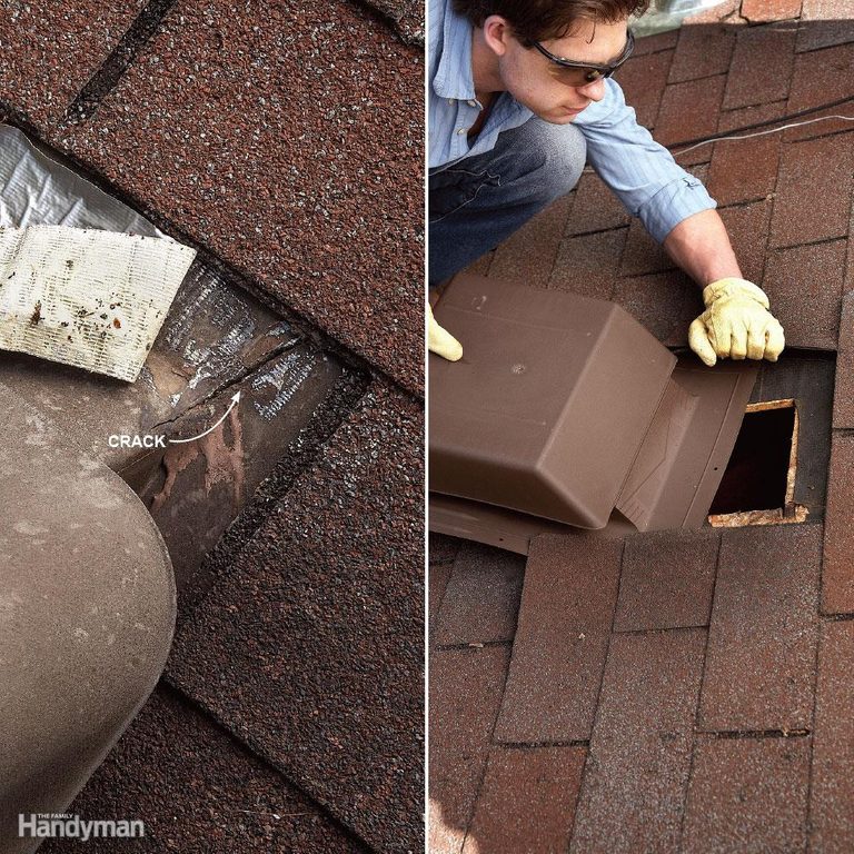 A man is removing a box from the roof of a house.