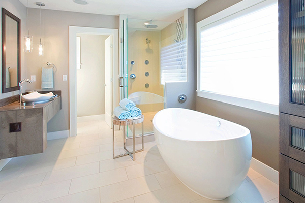 A bathroom with a large tub and white tile floors.