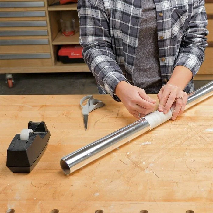 A person working on a project in a workshop.